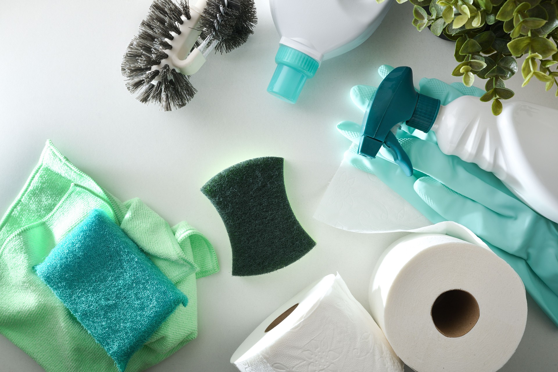 Bathroom cleaning supplies on white table top view